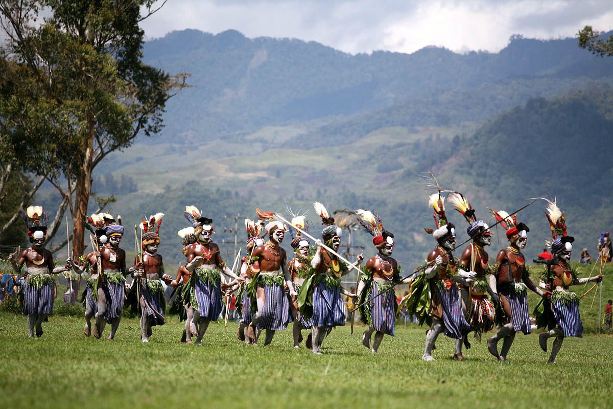 Highlands dancers in feathered headdresses and traditional dress at the Mount Hagen cultural show, Papua New Guinea.